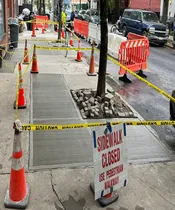 removing sidewalk violation in queens